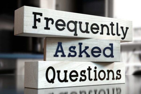 frequently asked questions written on wooden block depicting heating efficiency FAQs