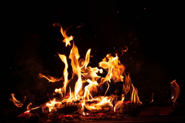 burning firewood depicting burning smell from air conditioner