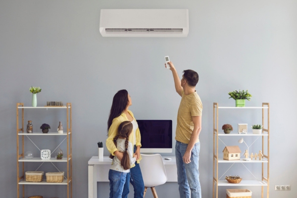 family excited for a newly installed ductless air conditioner depicting advantages of ductless systems