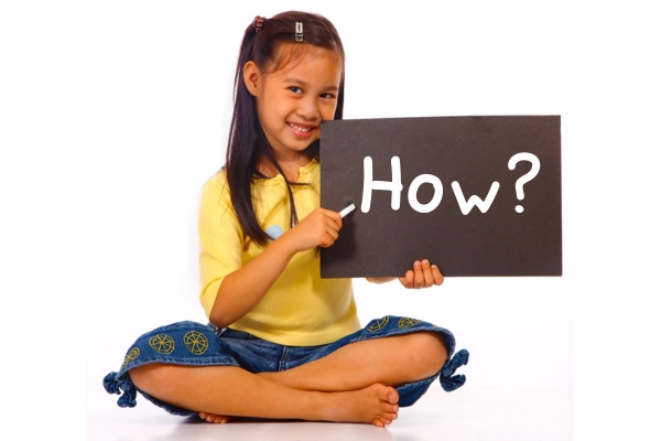 young girl holding a board with how written on it depicting ways to stay cool without AC