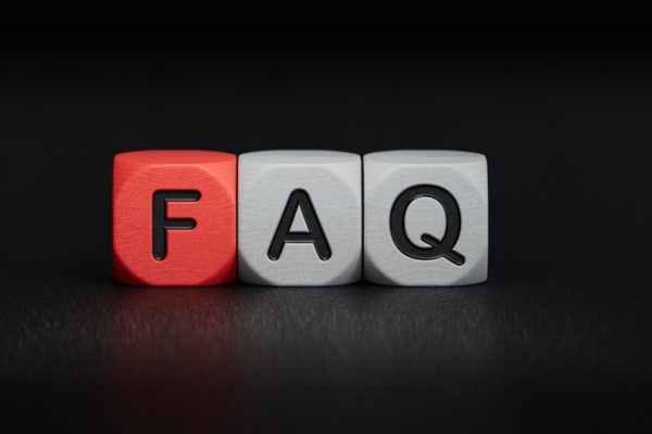 FAQ spelled using wooden block depicting air conditioner cover questions