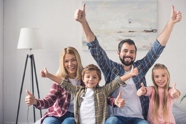 family with thumbs up and heating